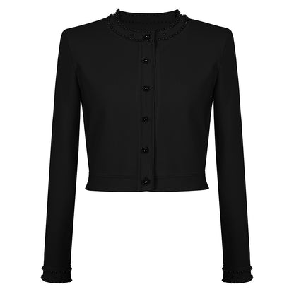 Sharon met parel bezet vest en jurk