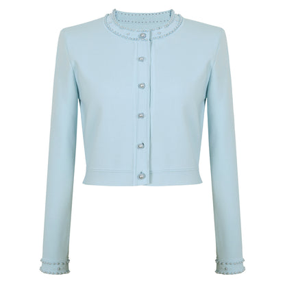 Sharon met parel bezet vest en jurk